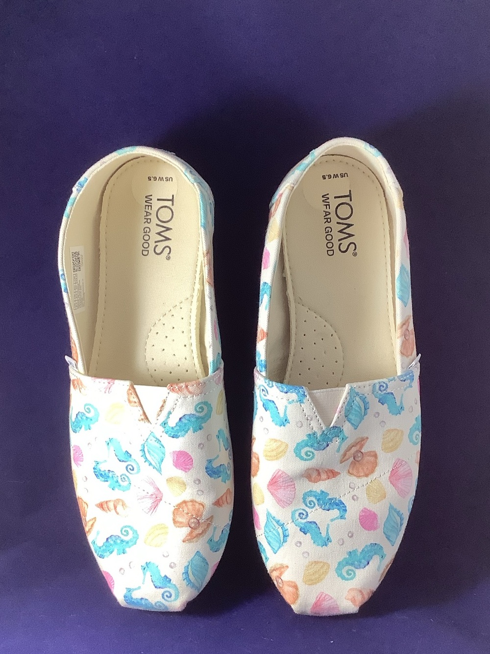 TOMS Light Cream Canvas Slip-Ons with Multicolor Seaside Print